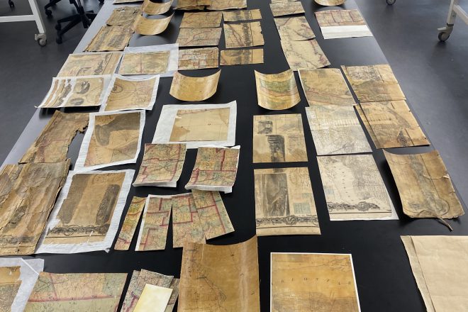 Photo of map segments on table