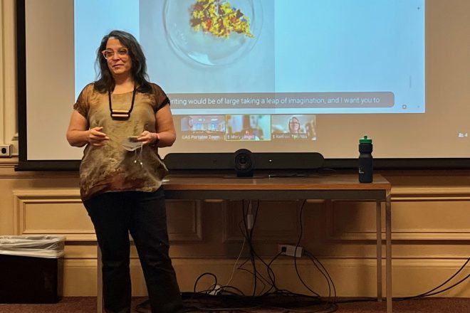 Professor Kelly Cobb presenting in front of a screen at Thing Tank